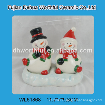 Creative snowman shaped ceramic salt and pepper container with the base